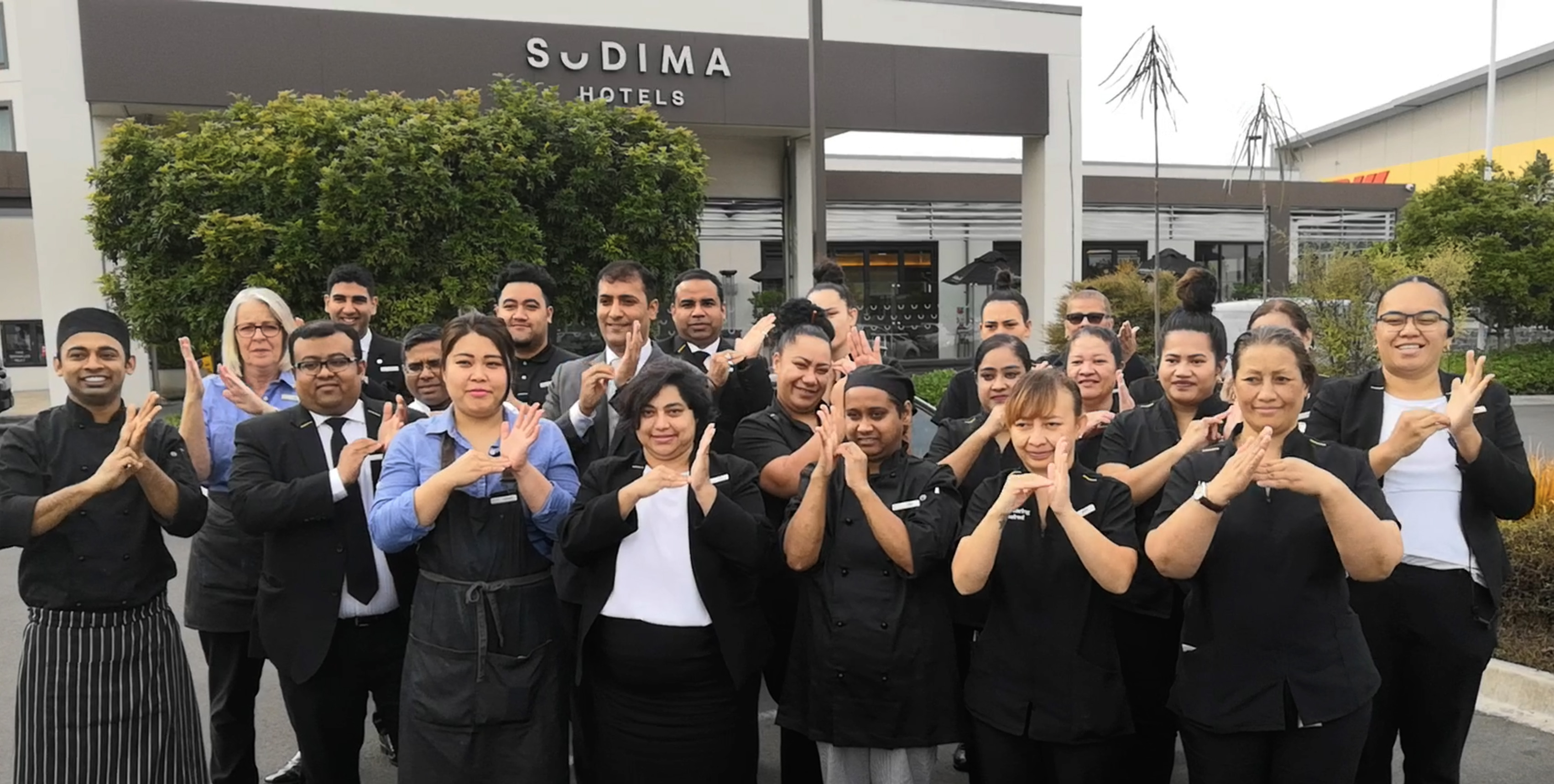 Team at Auckland Airport Hotel doing a welcome in sign language